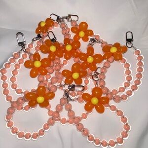 1-wrist lanyard for cells, keys and more
Peach/Orange Oversized Flower Charm
